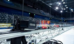 Electric chain hoists lift trusses in ice hockey stadium
