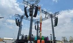 Trusses and GIS electric chain hoists are used to set up a mobile stage