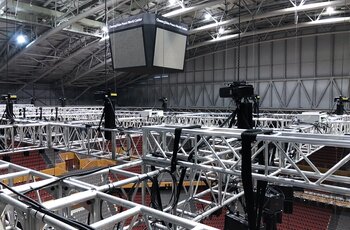 GIS Electric chain hoists carry truss in stadium