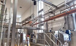 A workplace in food production is equipped with a rust-resistant suspension crane