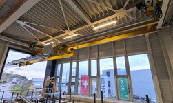 The crane bridge of the overhead crane is equipped with a telescopic boom that can be extended when needed.