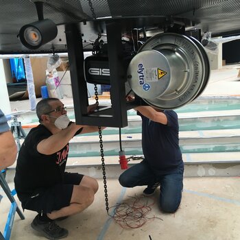 Installation of electric chain motor An entertainment electric chain hoist is installed in lamp construction