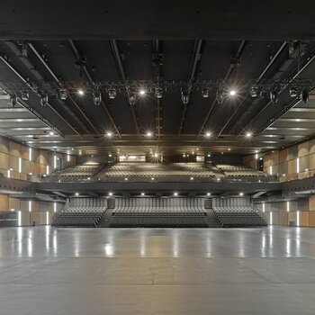 The concert hall with the basic framework of the rigging system with electric chain hoists and motor trolleys