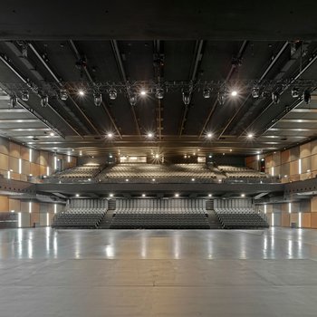 The concert hall with the basic framework of the rigging system with electric chain hoists and motor trolleys