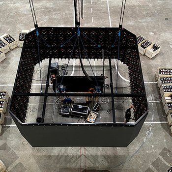 The video cube is lifted to the hall ceiling with electric chain hoists