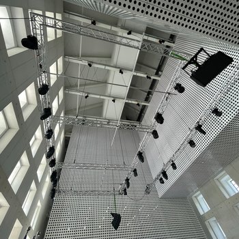 In the large room, the stage systems are raised and lowered by chain hoists