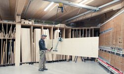 Electric chain hoist with sheet material grab to lift wood plates