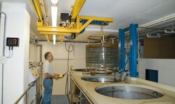 In very tight spaces, a container is moved with a crane system