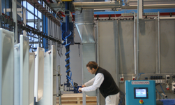 Telescopic chain hoist combined with light crane system lifts and moves a bathtub