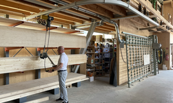 Crane system with curve for transporting wooden panels
