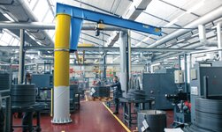 Large cable reel is lifted with slewing crane