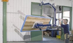 Vacuum handling system is used in carpentry to turn tables
