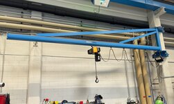 The electric chain hoist on the slewing crane is used to transport goods to the welding table