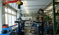 Crane system with gripper arm for moving cable reels