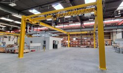 A free-standing system provides for the overhead transport of goods